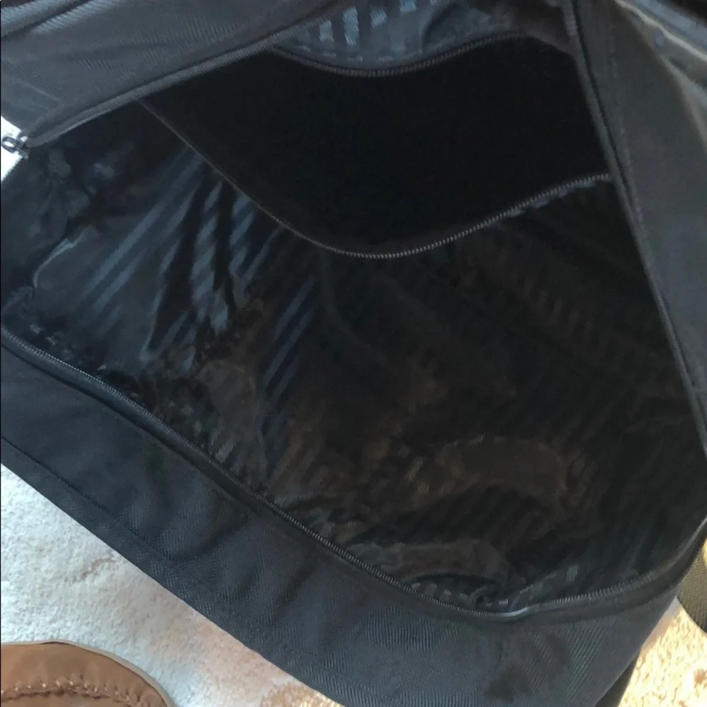 Tumi expandable crossbody suitcase/briefcase
